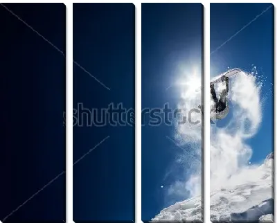 Сноубордист делает высокий эффектный прыжок