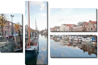 Историческая портовая часть Роттердама с парусниками и лодками