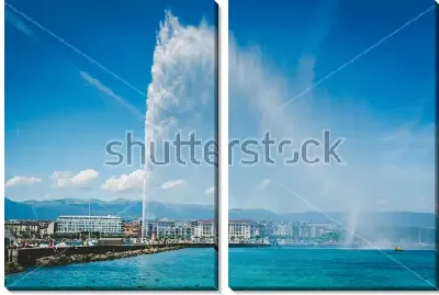 Знаменитый фонтан Же-До на Женевском озере и панорама Женевы на дальнем плане