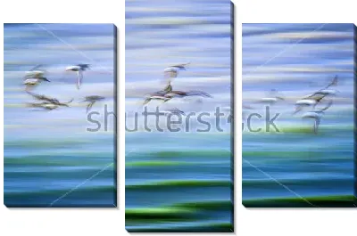 Модульная картина Двойная экспозиция со стаей улетающих птиц и переливами мелких волн