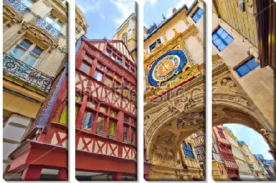 Модульная картина Фрагмент с яркими домами средневековой архитектуры и большими уличными часами над аркой в Руане (Франция)