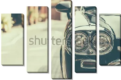 Фары красивого чёрного автомобиля крупным планом