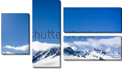 Модульная картина Горные вершины заснеженного ледника Франца-Иосифа на фоне голубого неба и низких облаков (Новая Зеландия)