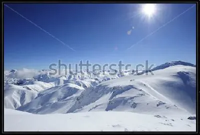 Картина Яркое солнце над снежными горными вершинами