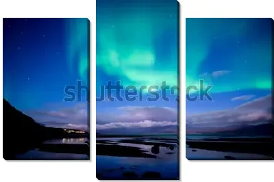 Северное сияние над спокойным озером в Национальном парке Абиско (Швеция)