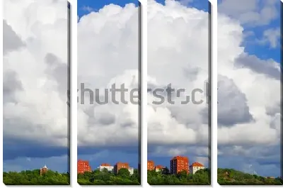 Прекрасные белые облака над красными домами Гётеборга (Швеция)