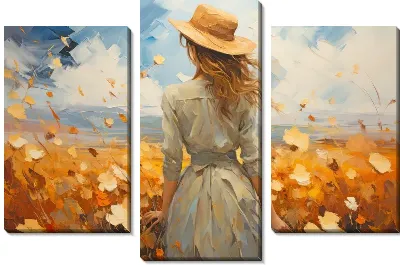 Девушка в шляпе в ветряном поле подсолнухов