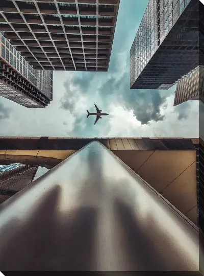 Постер Самолет пролетает над небоскребами Чикаго