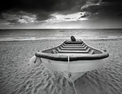 Плакат Лодка на берегу океана (A boat on the ocean)