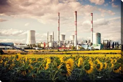 Постер Завод на фоне подсолнухов