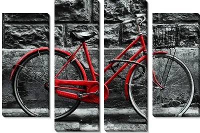 Красный велосипед на фоне каменной стены