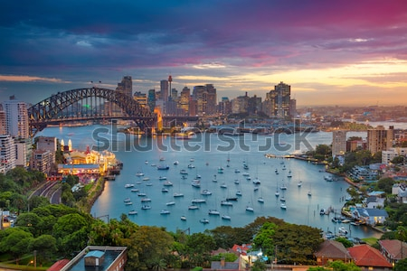 Постер Великолепная панорама Сиднея с видом на мост Харбор-Бридж на фоне яркого заката  