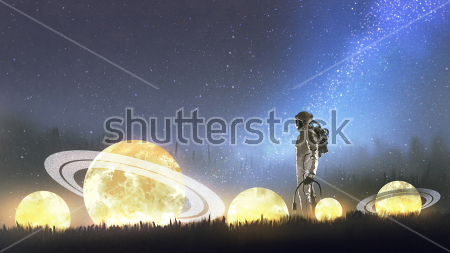 Картина Астронавт среди упавших в траву планет 
