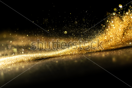 Картина Эффектный всплеск золотой пыли  на чёрном фоне 