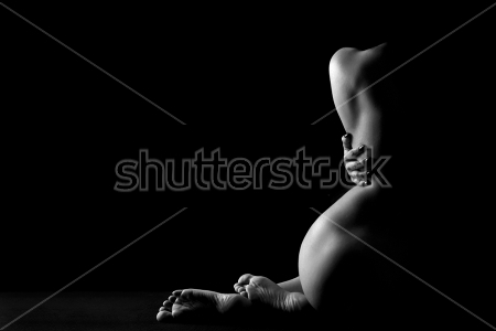 Постер Силуэт красивого женского тела в красивом освещении на чёрном фоне  