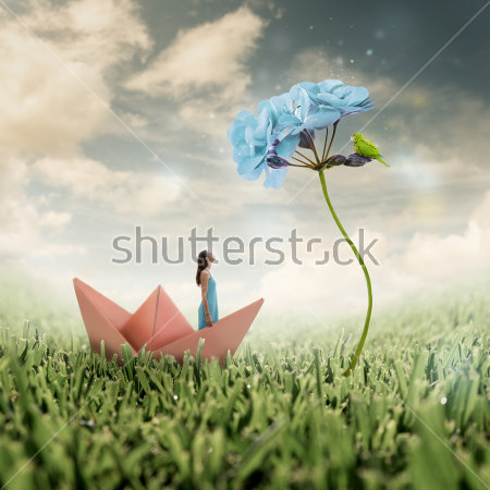 Картина Красивый коллаж с девушкой, плывущей в бумажном кораблике по траве, веточкой голубой гортензии и облачным небом 