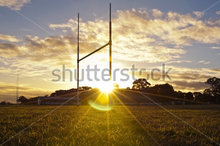 Картина Ворота на поле для игры в регби в лучах красивого заката 